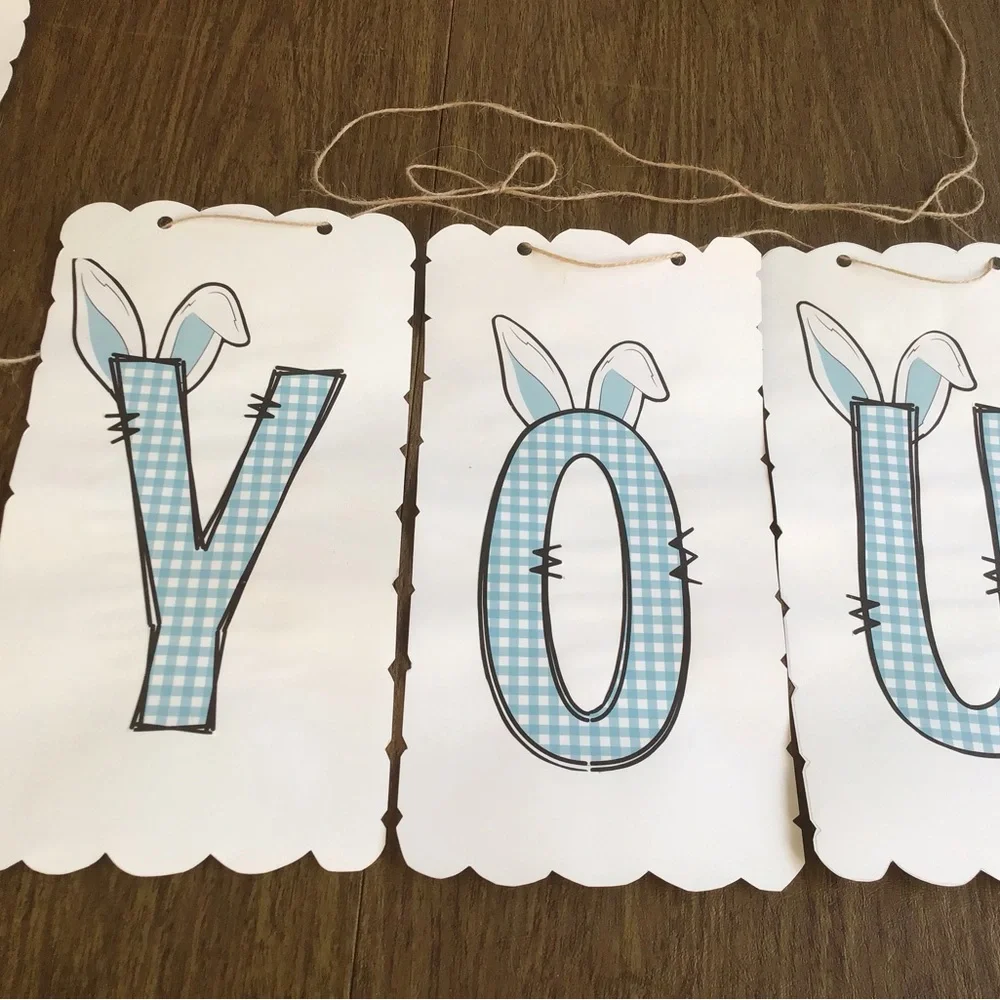 Thank you sign made with bunny ears on card paper